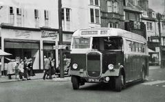 Bus pulling out of Wellington Place c1957